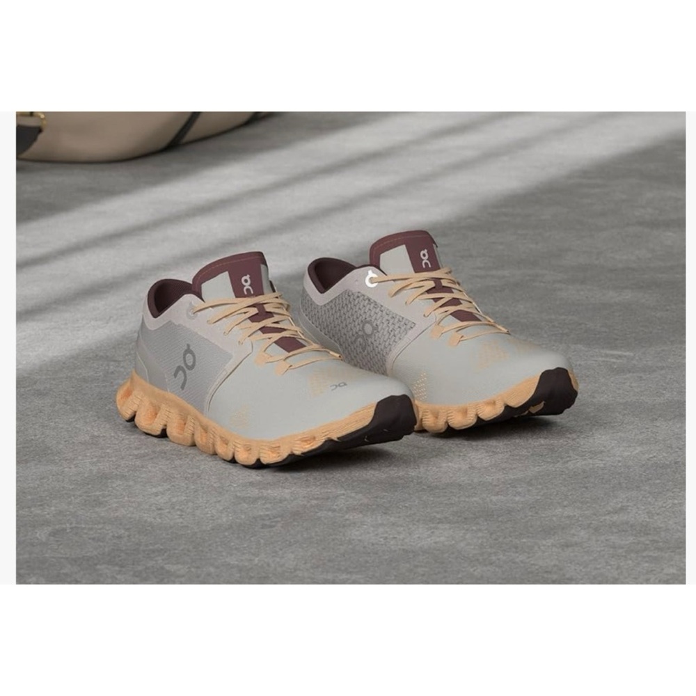 On Running Cream and Orange Athletic Shoes Modern Minimalist Design